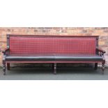 A 19th century style mahogany settle, of long proportions,