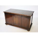 A 1920's oak coffer, with linen fold panelled front,