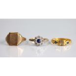 Three rings, to include; a diamond and sapphire daisy cluster ring,