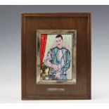 An enamel plaque of Harlequin after Pablo Picasso, the plaque within a white metal frame,
