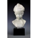 An Austine Prodine composition bust of a young girl with plaited hair, signed and dated 1973,