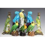 A pair of 18th century style Chinese brass mounted candlesticks modelled as parrots, 37cm,