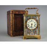 A late 19th century French brass and champleve enamel carriage time piece,