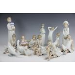 A collection of fifteen Nao figures, including ballerinas, girls seated,