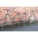 A set of four Vintage style metal frame stools, with adjustable circular seats,