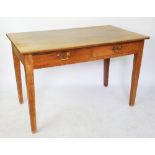 An early 20th century Cotswold type oak side table, with two drawers, on tapered legs,