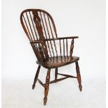 A 19th century ash and elm Windsor type chair, with hoop back and solid seat, on turned legs,