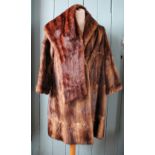 A ladies three quarter length fur coat,