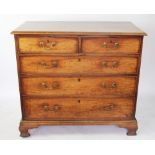 A George III mahogany chest, with two short and three graduated long drawers, on ogee bracket feet,