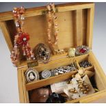 A collection of assorted costume jewellery and ephemera within a pine box,