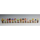 A large collection of novelty ceramic bottle corks/stops, including male and female heads, animals,
