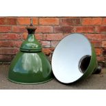 A pair of vintage green enamel industrial ceiling lights,