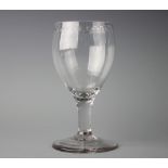 A 18th century glass goblet, with engraved oxo band above a plain stem and conical foot, 16.