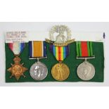 A World War I and II medal group of four to 17082 Pte C S Quevillart, Norf.