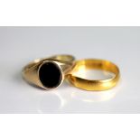 A 22ct yellow gold wedding band, size M, weight 2gms and a stone set 9ct gold signet ring, 3.