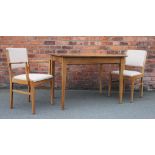 A Gordon Russell walnut extending dining table, on tapered legs, 77cm H x 108cm W x 58cm D,