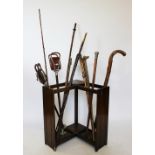 A selection of 19th century and later walking sticks and shooting sticks,