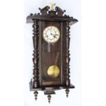A walnut drop dial wall clock, possibly Ansonia, with Roman numeral dial, 79cm,