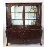 A late 19th century French / Italian carved walnut vitrine,