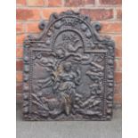 A cast iron fire back, dated 1679, cast with a maiden and cherub and titled 'PAX',