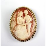A carved shell cameo brooch/pendant with 9ct yellow gold surround,
