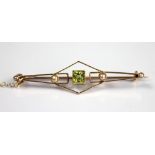 A peridot and seed pearl set brooch,