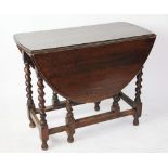 A 1920's oak gate leg table, on barley twist legs,