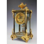 A late 19th century American gilt brass four glass mantel clock,