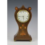 An Edwardian Art Nouveau inlaid mahogany mantel time piece,