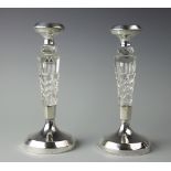 A pair of silver mounted and cut glass candlesticks, Sanders & Mackenzie, Birmingham 1927,