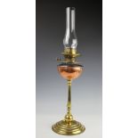 An Arts and Crafts style copper and brass oil lamp, with The Atkins Patent stoneware water filter,