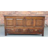 An 18th century oak mule chest, the four panel front carved 'MM 1742', with three drawers,