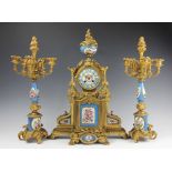 A 19th century French gilt metal and Sevres style porcelain mounted clock garniture,