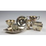 A selection of silver comprising; an Edwardian silver navette shaped desk stand, Samuel M Levi,