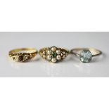 A Victorian emerald and pearl set flower cluster ring, with vacant locket back,