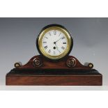 A late Victorian walnut mantel time piece, enamelled Roman numeral dial and eight day movement,