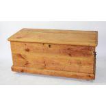 A pine chest / blanket box, with hinged lid, on plinth base, with iron handles to side,