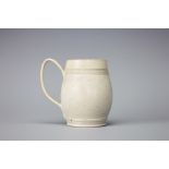 An 18th century salt glazed stoneware mug, of barrel form with reeded design, 9.