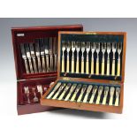A set of twelve pairs of silver plated fish knives and forks, in walnut case,