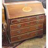 An Edwardian inlaid mahogany bureau, with fall enclosing a fitted interior,