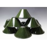 Twelve vintage style green enamel light shades,