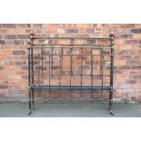 A cast iron bed head, stead and accompanying irons,