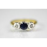 A sapphire and diamond three stone ring,