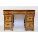 A Victorian inlaid ash pedestal desk, with an arrangement of seven drawers, on plinth base,