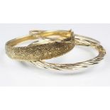 Three yellow metal bangles, one stamped '375', gross weight 19.