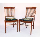 A set of ten Edwardian dining chairs, in the Arts and Crafts manner,