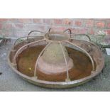 A late 19th century cast iron circular pig trough,