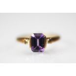 A 9ct rose gold, amethyst and diamond set ring,