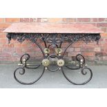 A modern French marble top kitchen table / with iron and brass base with pierced foliate frieze,