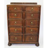 A 1920's oak chest of five graduated long drawers, on bun feet, 103cm H, 77cm W,
